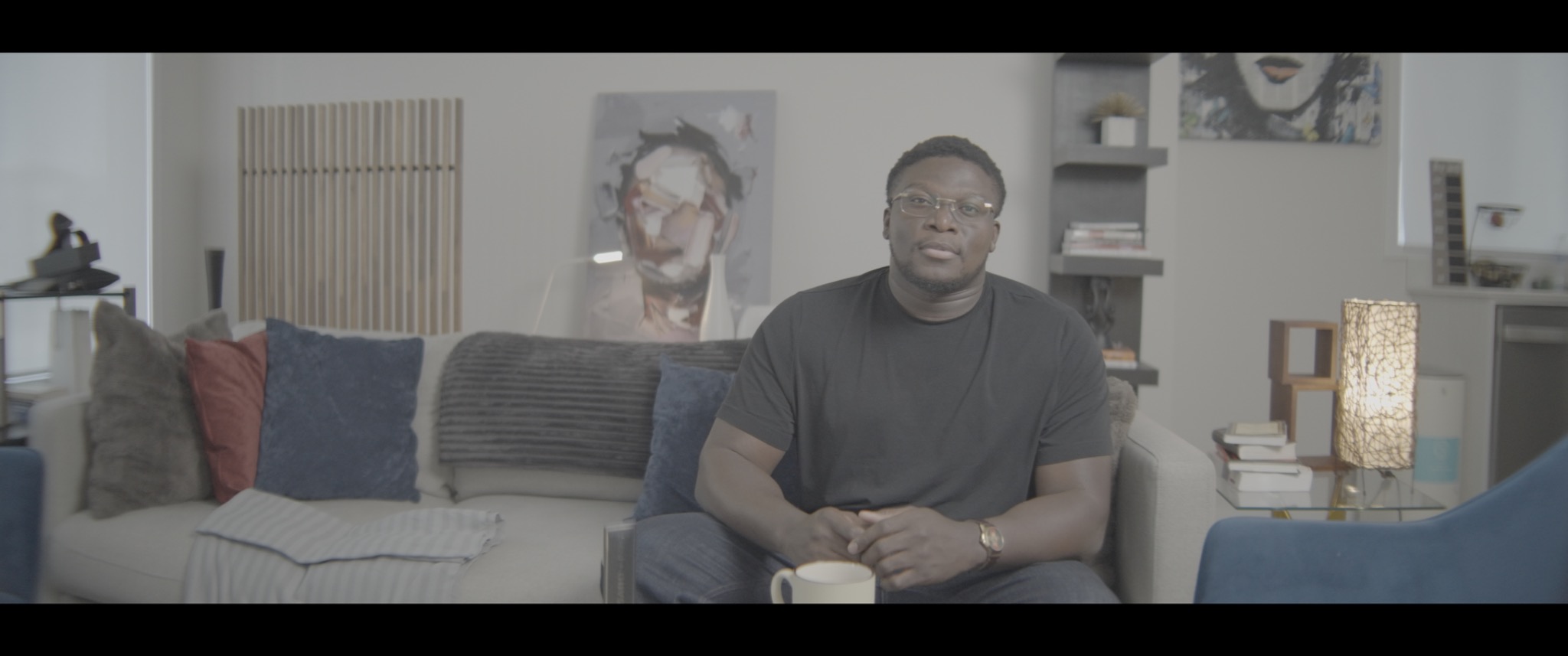 The original LOG image of the same room scene before the final colour grade